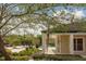 Community pool and adjacent clubhouse at 4115 Chatham Oak Ct # 218, Tampa, FL 33624