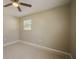 Bedroom featuring tile floors, a ceiling fan, and a window with blinds at 1048 S Allendale Ave, Sarasota, FL 34237