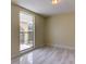 Bright bedroom with large window and tile floors at 7820 Sycamore Dr, New Port Richey, FL 34654
