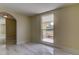 Bright dining room with tile floors and arched entryway leading to other rooms at 7820 Sycamore Dr, New Port Richey, FL 34654