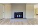 Gray brick fireplace with a glass door at 7820 Sycamore Dr, New Port Richey, FL 34654