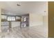 Open kitchen with island and dining area at 7820 Sycamore Dr, New Port Richey, FL 34654