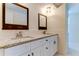 Modern bathroom with double vanity, granite countertop, and large mirrors at 7820 Sycamore Dr, New Port Richey, FL 34654