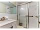 Clean bathroom featuring a shower/tub combo and updated vanity at 7820 Sycamore Dr, New Port Richey, FL 34654