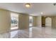 Living room with large windows and tile floors at 7820 Sycamore Dr, New Port Richey, FL 34654