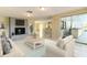 Living room with fireplace, kitchen view, and access to patio at 7820 Sycamore Dr, New Port Richey, FL 34654