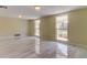 Living room with large windows and tile floors at 7820 Sycamore Dr, New Port Richey, FL 34654