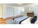 Spacious main bedroom with hardwood floors, large closets and window at 7820 Sycamore Dr, New Port Richey, FL 34654