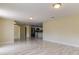 Bright living room with tile floors and views into the kitchen at 7820 Sycamore Dr, New Port Richey, FL 34654