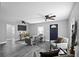 Spacious living room with gray sofa and two armchairs at 3007 Dixie Ave, Sarasota, FL 34234