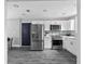 Modern kitchen features stainless steel appliances and white shaker cabinets at 3007 Dixie Ave, Sarasota, FL 34234