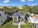 Modern two-story house with gray roof, stone accents, and landscaped yard at 1321 W Arch St, Tampa, FL 33607