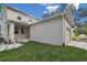 Two-story house with attached garage and a nicely landscaped front yard at 1321 W Arch St, Tampa, FL 33607