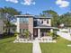 Modern two-story house with stone accents and walkway at 1321 W Arch St, Tampa, FL 33607