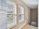 Light-filled stairwell with two windows and light wood floors at 1321 W Arch St, Tampa, FL 33607