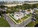 Two story house on a tree-lined street near a highway at 1323 W Arch St, Tampa, FL 33607