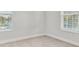 Spacious bedroom with neutral walls and two large windows at 1323 W Arch St, Tampa, FL 33607