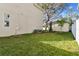 Landscaped side yard with new plantings and AC units at 1323 W Arch St, Tampa, FL 33607