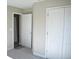 Spacious bedroom with neutral walls and double door closet at 1937 W Arch St, Tampa, FL 33607