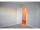 Bedroom with carpet, an open door, and light walls at 1939 W Arch St, Tampa, FL 33607