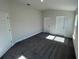 Spacious bedroom with gray carpeting and two closets at 13187 Ogden Glade Rd, Dade City, FL 33525