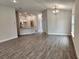 Open living room and dining area with tile flooring and neutral color palette at 13203 Ogden Glade Rd, Dade City, FL 33525