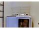 Laundry room with washer, dryer, and shelving at 2409 Heather Manor Ln, Lutz, FL 33549