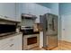 Stainless steel appliances and granite countertops in this kitchen at 2409 Heather Manor Ln, Lutz, FL 33549