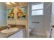 Clean bathroom with granite countertop, shower, and toilet at 2409 Heather Manor Ln, Lutz, FL 33549