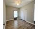Spacious bedroom with vinyl flooring and plantation shutters at 0 Pevetty, Plant City, FL 33563