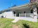 Contemporary home featuring a covered patio and grassy backyard at 0 Pevetty, Plant City, FL 33563