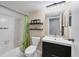 Clean bathroom with a bathtub, shower, and modern vanity at 5038 Marsh Field Rd # 18, Sarasota, FL 34235