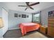 Bright bedroom with double bed, ceiling fan, and ample closet space at 5038 Marsh Field Rd # 18, Sarasota, FL 34235