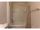 Bathroom bathtub with shower and patterned curtain at 2855 Maiden Grass Isle, Wesley Chapel, FL 33543