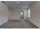 Carpeted bedroom featuring natural light and a spacious closet at 2855 Maiden Grass Isle, Wesley Chapel, FL 33543