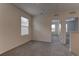 Upstairs bedroom features neutral carpet and windows for ample natural light at 2855 Maiden Grass Isle, Wesley Chapel, FL 33543