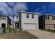Charming two-story home featuring a two-car garage and neutral stucco exterior at 2855 Maiden Grass Isle, Wesley Chapel, FL 33543