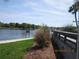 Waterfront view with grassy area and walkway at 2424 W Tampa Bay Blvd # L202, Tampa, FL 33607