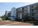 Exterior of a three story building with blue accents at 2424 W Tampa Bay Blvd # L202, Tampa, FL 33607