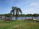 Peaceful waterfront view with two park benches at 2424 W Tampa Bay Blvd # L202, Tampa, FL 33607