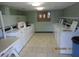 Clean laundry room with multiple washers and dryers at 2424 W Tampa Bay Blvd # L202, Tampa, FL 33607