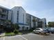 Exterior of a three story building with blue accents at 2424 W Tampa Bay Blvd # L202, Tampa, FL 33607