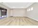 Bright living room featuring hardwood floors and sliding glass doors leading to a patio at 32330 Wetland Bird Vw, San Antonio, FL 33576