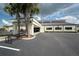 Exterior view of community fitness center building with palm trees at 718 Chipper Dr, Sun City Center, FL 33573
