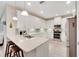 Modern kitchen with white cabinets, granite countertops and island at 718 Chipper Dr, Sun City Center, FL 33573