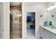 Bathroom with walk-in shower, double vanity, and separate closet at 718 Chipper Dr, Sun City Center, FL 33573