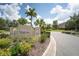 Verona community entrance with lush landscaping at 718 Chipper Dr, Sun City Center, FL 33573