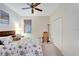 Bedroom with ceiling fan and large closet at 718 Chipper Dr, Sun City Center, FL 33573