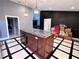 Modern kitchen with a large island and stainless steel appliances at 5407 Bailey Rd, Plant City, FL 33565