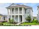 Two-story home with light blue exterior and a front porch at 3659 Tea Leaf Aly, Land O Lakes, FL 34638